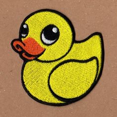 a yellow rubber ducky with big eyes