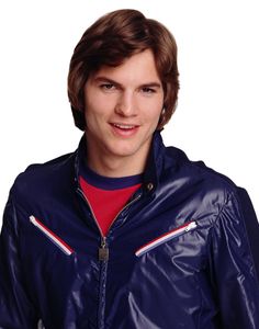 a young man wearing a blue leather jacket