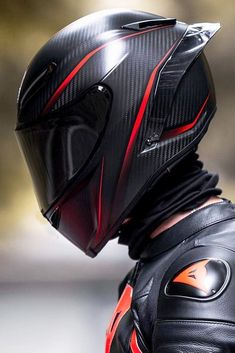 a person wearing a motorcycle helmet and protective gear