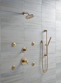 the shower head and handset are shown in this modern style bathroom with white tile