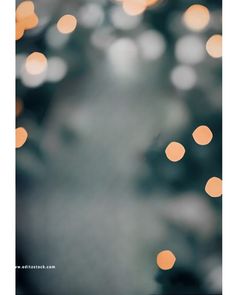 blurry image of lights in front of a black and white background with orange circles