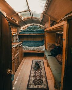 an inside view of a small camper with bunk beds