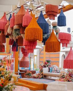 many different colored hanging decorations in a room