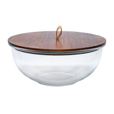 a glass bowl with a wooden lid