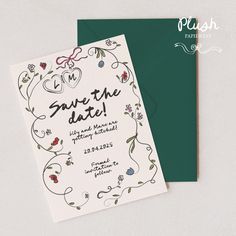 a wedding save the date card on top of a green envelope with flowers and hearts