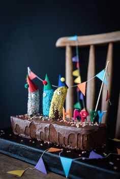 a birthday cake with candles and decorations on it