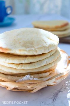 a stack of pita bread sitting on top of a plate