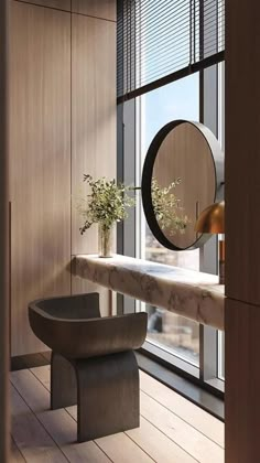 an empty room with a bench, mirror and vase on the window sill in front of it