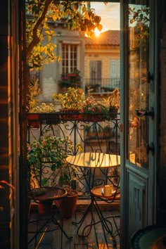 Cozy sunset on a small balcony adorned with lush plants and a wrought iron table, embodying small balcony design ideas. Balcon Decor, Cozy Balcony Aesthetic, Bedroom Addition Ideas, Quiet Minimal, French Balcony, Apartment Loft