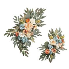 two wall hangings decorated with flowers and greenery on each side, one in the shape of a wreath