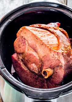 a cooked meat in a pot with some sauce on the top and side, ready to be eaten