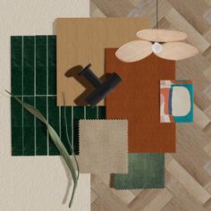 an arrangement of rugs and accessories on a wood flooring pattern with green grass