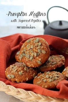 pumpkin muffins with sugared - pecans in a basket on a table