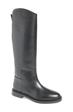 An angled shaft lends visual intrigue to a smooth leather riding boot ready to make your outfit complete. 1" heel 14 1/2" shaft; 14 3/4" calf circumference Pull-on style Leather upper/textile and synthetic lining/synthetic sole Imported Knee-high Moto Boots For Work, Medium Width, Medium Width Knee-high Moto Boots For Work, Leather Knee-high Riding Boots, Knee-high Moto Boots For Workwear, Knee-high Moto Boots For Work, Make Your Outfit, Womens Riding Boots, Black Riding Boots, Riding Boot