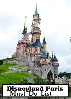 the disneyland paris must do list is in front of a castle with gold and blue spires