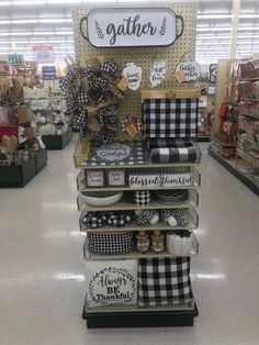 a store display with black and white items on it's shelves in the aisle