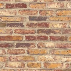 an old brick wall is shown in this image