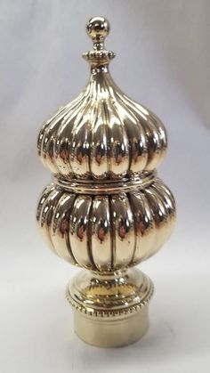 an ornately decorated silver container on a white background