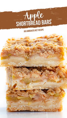 Three bars are stacked on each other on a white surface with a white background. Shortbread Apple Pie, Shortbread Pie Crust Filling, Apple Crisp With Shortbread Crust, Apple Crisp Shortbread Bars Recipe, Apple Crisp Shortbread Bars, Apple Pie Cookie Bars, Apple Crumble Slice, Apple Cake Bars, Shortbread Pie Crust Desserts