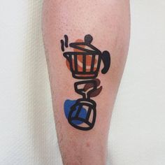 a man with a tattoo on his leg that has a coffee pot and kettle in it