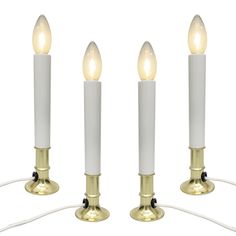 three white candles with one light turned on and the other turned off in different positions