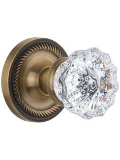 an antique style door handle with crystal knobs