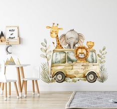 a children's room with a wall mural featuring animals and giraffes