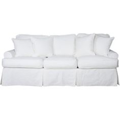 a white couch with pillows on it