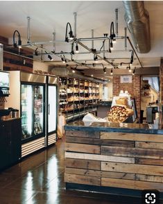 the inside of a store with lots of items on display and wood pallets in front of it