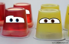 four plastic cups with eyes and noses on them