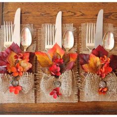 the forks are decorated with fall leaves and burlap