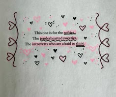 a piece of paper with some pink hearts on it and a quote written in the middle