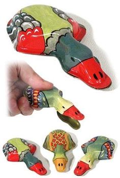 a hand is holding some colorful ceramic items