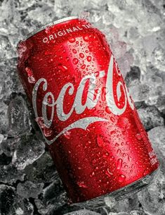 a can of coca cola sitting on top of ice