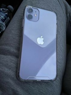 an iphone case sitting on top of someone's lap