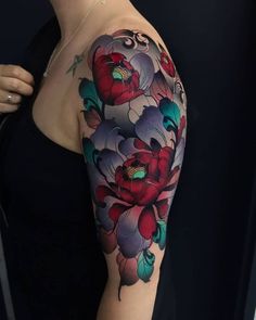 a woman's half sleeve tattoo with flowers on her left arm and the other half