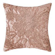 a rose gold velvet pillow with an intricate design on the front and back, along with a