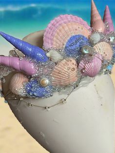 Shimmery Shells Pastel Mermaid Crown by The Head Mistress Hand-painted shells and glitter for a mesmerizing mermaid allure Bubble beads and moonstone chains infuse an air of sophistication Available in both bold and pastel color palettes to suit your style Adjustable metal base with loops for effortless fastening using bobby pins Perfect for enchanting mermaid sessions and tailored for the sea's divas Suitable for ages 6 and above Unleash your inner mermaid and make a splash with this stunning c Mermaid Crown Diy, Pastel Mermaid, Bubble Beads, Crown Diy, Mermaid Crown, Fabric Photography, Painted Shells, Pastel Colour Palette, Photography Backdrops