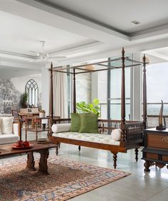 a living room filled with furniture and lots of windows