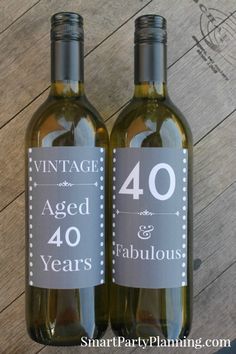 two wine bottles sitting on top of a wooden table next to each other with the numbers forty and forty