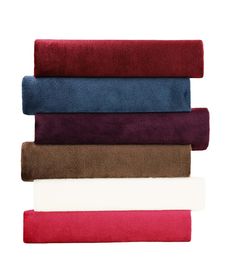 four different colored towels stacked on top of each other