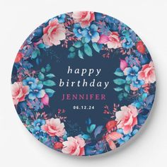 a blue and pink floral birthday plate with the words happy birthday written in front of it