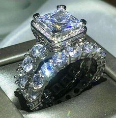 a close up of a diamond ring on top of a silver box with the words chocong written below it