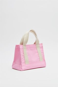 Introducing the Pink Women Canvas Mini Tote Bag from Lunarity Garage, a charming and versatile accessory that adds a playful touch to your everyday style. This mini tote bag features a delightful pink color, exuding femininity and vibrancy. Crafted with meticulous attention to detail, this mini tote bag combines fashion and functionality. The compact size makes it perfect for carrying your essentials on the go, while the durable canvas material ensures long-lasting use. The pink color adds a che Casual Pink Top Handle Shoulder Bag, Pink Satchel For Daily Use In Summer, Summer Pink Top Handle Bag, Pink Top Handle Bag For Summer, Cute Pink Everyday Bags, Casual Pink Top Handle Bag, Pink Tote Canvas Bag For Shopping, Summer Pink Bags With Top Carry Handle, Pink Tote Bag With Top Carry Handle