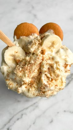 an ice cream sundae topped with bananas and cinnamon