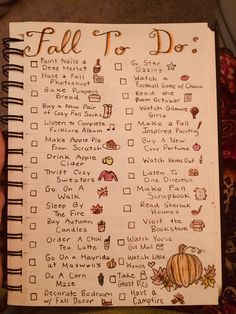 a hand holding a notebook with a fall to do list on it