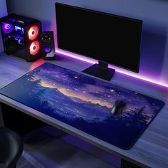 a computer desk with a monitor, speakers and a gaming mouse on it in front of a purple background