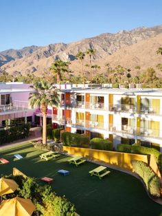 an aerial view of the palm springs hotel and surrounding area with mountains in the background