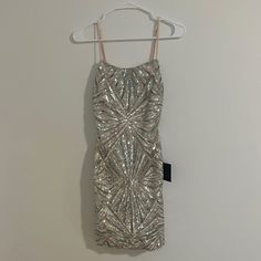 This Dress Is Perfect For Homecoming! Very Flattering And Comfortable! Silver Dress Short Lulus, Silver Hoco Dresses Short Tight, Silver Sleeveless Mini Dress For Homecoming, Embellished Silver Mini Dress For Prom, Silver V-neck Mini Dress For Formal Occasions, Be Perfect, Homecoming, Homecoming Dresses, Prom