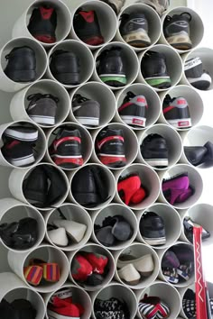 there are many pairs of shoes on the wall